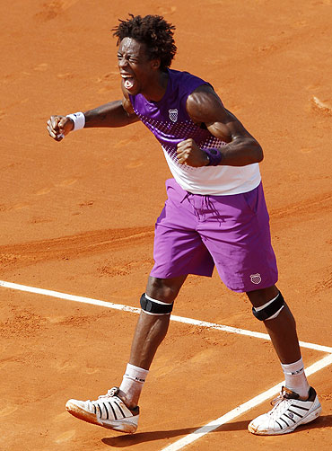 Gael Monfils of France reacts after winning his match against David Ferrer of Spain