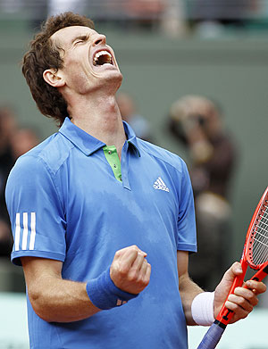 Andy Murray of Britain reacts after defeating Viktor Troicki of Serbia