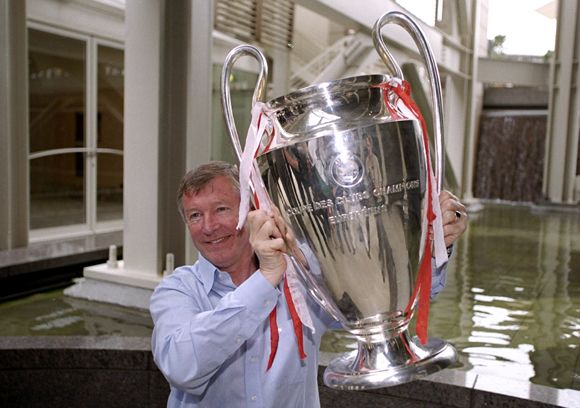 Sir Alex Ferguson with the 1999 UEFA Champions League trophy