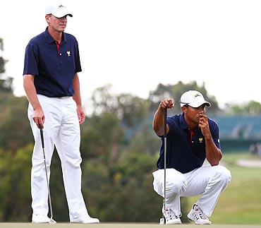Tiger Woods looks on with team-mate Steve Stricker during the Day One Foursome Matches of the Presidents Cup