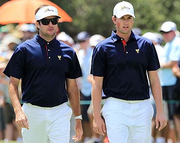 Watson of the US Team with team-mate Webb Simpson