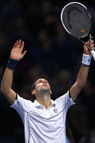 Novak Djokovic celebrates after winning his match against Tomas Berdych