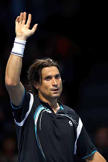 David Ferrer celebrates after winning his match against Andy Murray
