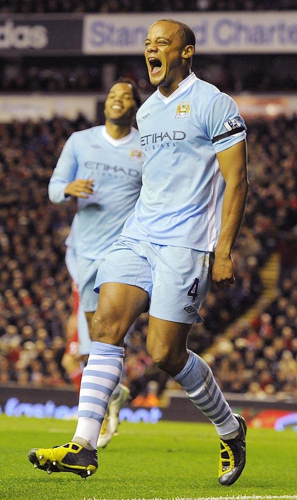 Manchester City's Vincent Kompany (right) celebrates after scoring against Liverpool