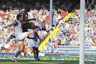 Manchester City's Mario Balotelli scores during his match against Blackburn