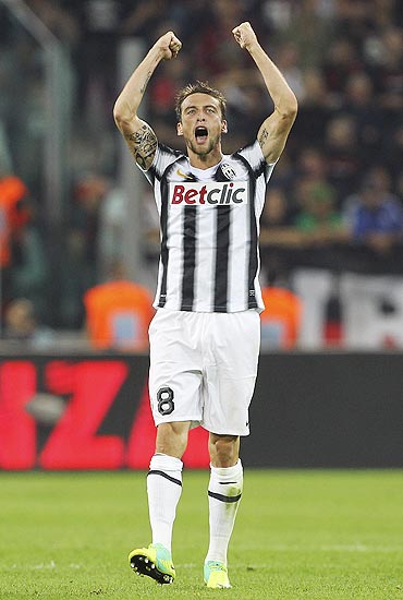 Claudio Marchisio of Juventus FC celebrates after scoring the opening goal during the Serie A match against AC Milan