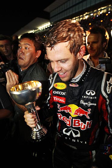 Sebastian Vettel celebrates in the pitlane
