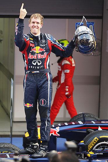 Sebastian Vettel of Red Bull celebrates in parc ferme after winning the Korean Formula One Grand Prix