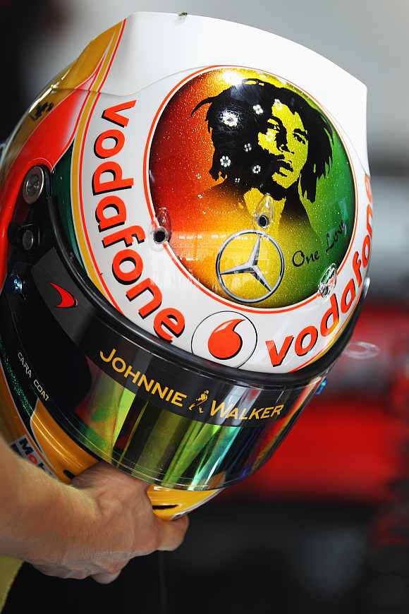 The specially designed drivers helmet of Lewis Hamilton of Great Britain and McLaren sporting a motif of Bob Marley
