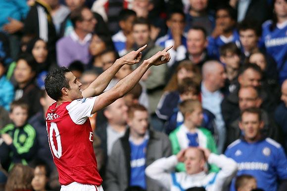 Robin van Persie celebrates after scoring against Chelsea