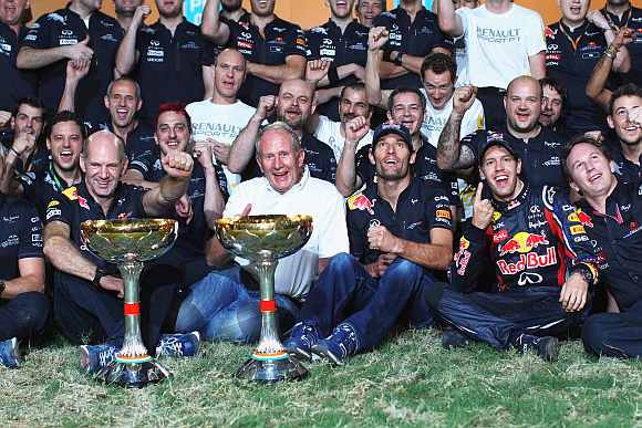 Red Bull Racing celebrates in the paddock after winning the Indian Formula One Grand Prix