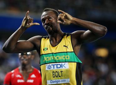 Usain Bolt of Jamaica celebrates winning his men's 200 metres semi final during day seven of 13th IAAF World Athletics Championships at Daegu Stadium