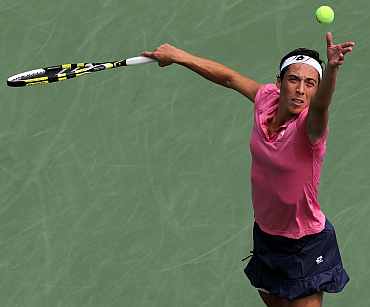 Francesca Schiavone serves during her match against Chanelle Scheepers