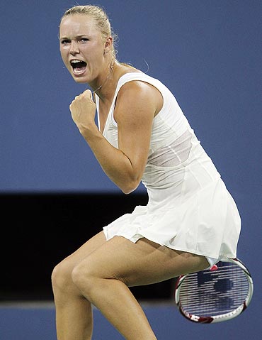 Caroline Wozniacki of Denmark celebrates winning the second set against Svetlana Kuznetsova