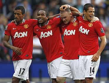 Wayne Rooney celebrates after scoring against Bolton Wanderers