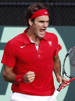 Roger Federer of Switzerland reacts after winning a point against Lleyton Hewitt of Australia during their Davis Cup match on Friday