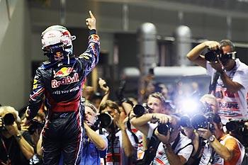 Sebastian Vettel Red Bull Racing celebrates on the podium after winning the Singapore Formula One Grand Prix