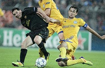 Bate Borisov's Yegor Filipenko (right) and Barcelona's Lionel Messi vie for possession during their Champions League match on Wednesday