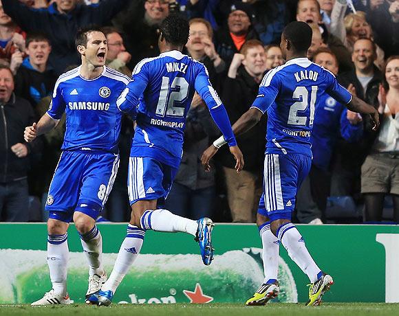 Frank Lampard (left) of Chelsea celebrates with team mates after scoring a penalty during their quarter-final agianst Benfica on Wednesday