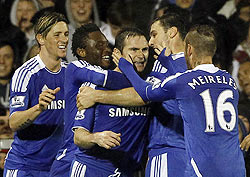 Chelsea players celebrate with Frank Lampard