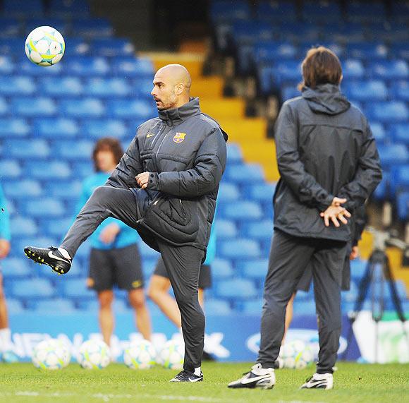 Coach Pep Guardiola of Barcelona shows off his footballing skills