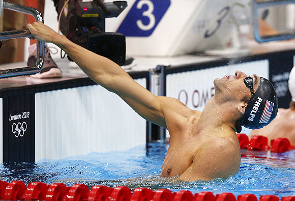 Michael Phelps reacts after his team won the men's 4 x 200m freestyle relay final on Tuesday