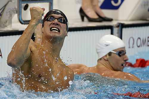 United States' Nathan Adrian, left, celebrates winning ahead of Australia's James Magnussen in the men's 100-meter freestyle swimming final