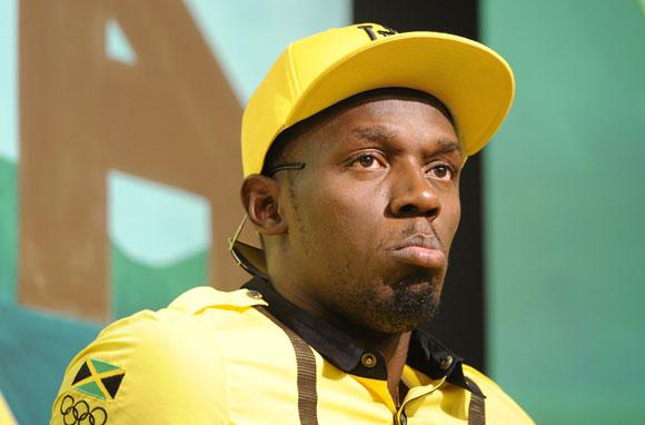 Jamaican sprinter Usain Bolt looks on during a team news conference in east London