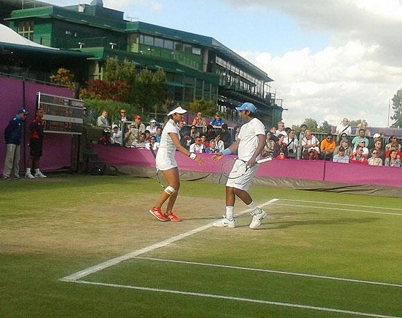 Leander Paes and Sania Mirza in action against Serbian pair of Ana Ivanovic and Nenad Zimonjic on Thursday