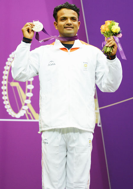 Silver medallist Vijay Kumar of India celebrates