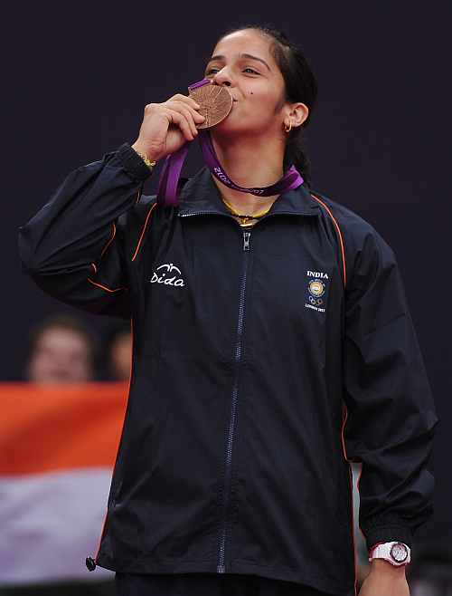 Saina Nehwal of India stands with her Bronze medal