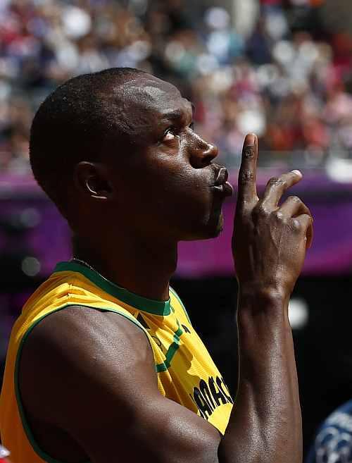 Usain Bolt of Jamaica prepares to start his round 1 men's 100m heat during the London 2012 Olympic Games