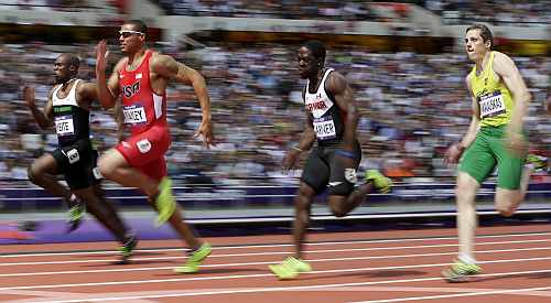 rom left, Ivory Coast's Ben Youssef Meite, United States' Ryan Bailey, Canada's Justyn Warner and Lithuania's Rytis Sakalauskas compete in a men's 100-meter heat