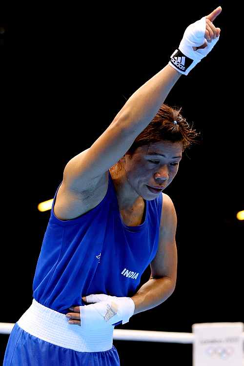 Mary Kom of India celebrates after defeating Maroua Rahali of Tunisia in the Women's Fly (51kg) Boxing quarterfinals