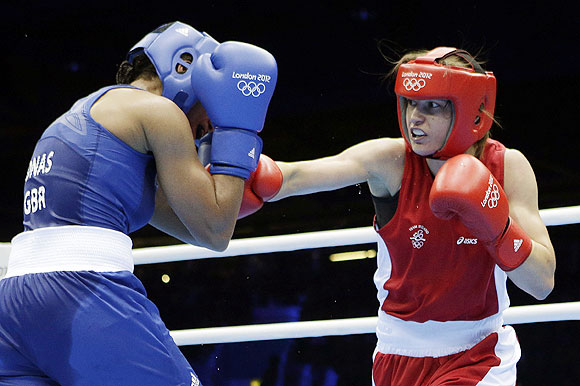 Ireland's Katie Taylor (right) throws a punch at Britain's Natasha Jonas in a women's lightweight 60-kg quarter-final boxing match on Monday