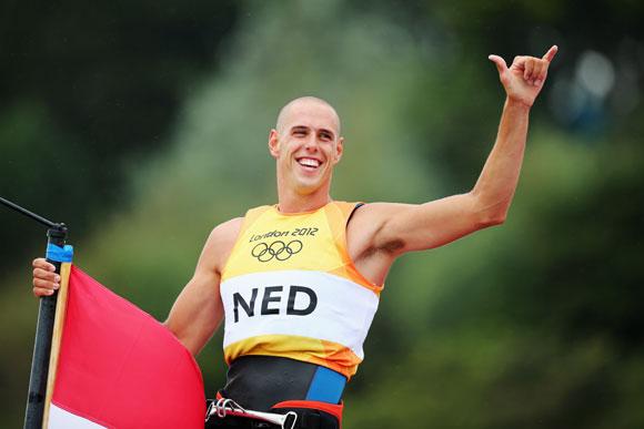 Dorian Van Rijsselberge of Netherlands celebrates after winning gold in the Men's RS:X Sailing