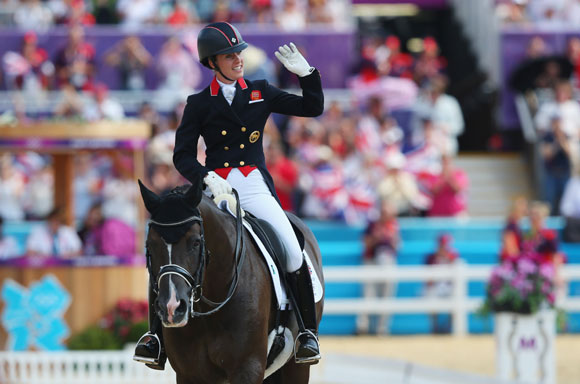 Charlotte Dujardin of Great Britain riding Valegro celebrates during the Individual Dressage