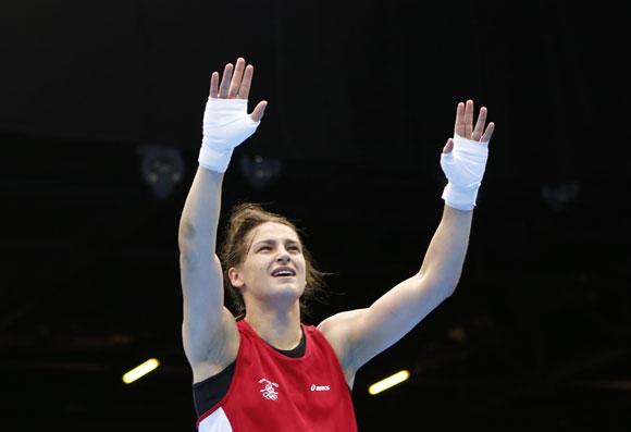 Ireland's Katie Taylor reacts as she is declared the winner over Russia's   Sofya Ochigava after their Women's Light (60kg) gold medal