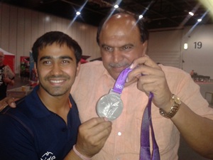 Sushil Kumar's brother Amarjeet (left) with coach Satpal