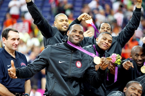 LeBron James of the United States and team mates celebrate on the podium