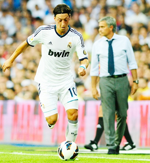 Mesut Ozil of Real Madrid runs with the ball