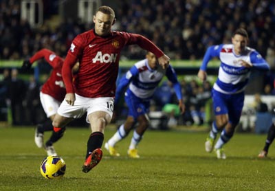 Manchester United's Wayne Rooney shoots to score