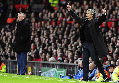 Jose Mourinho (right) gestures as Manchester United manager Alex Ferguson (left) watches