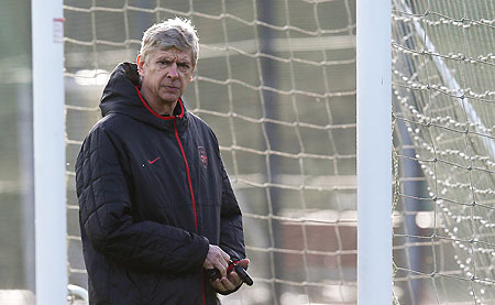 Arsenal manager Arsene Wenger attends a team training session
