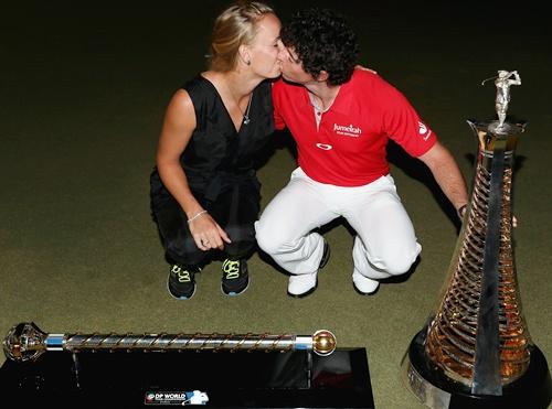 Rory McIlroy of Northern Ireland poses alongside his girlfriend Caroline Wozniacki