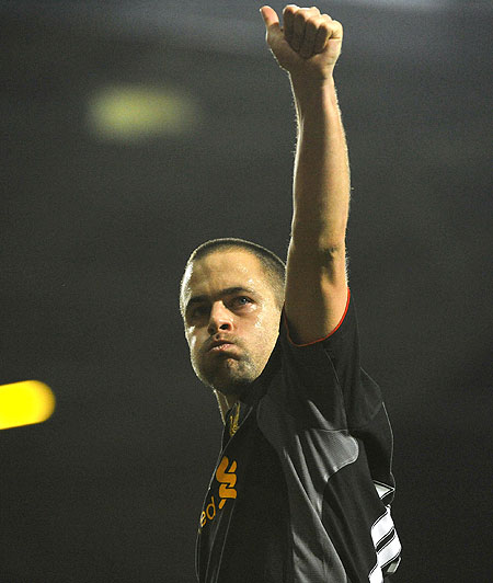 Liverpool's Joe Cole acknowledges fans following their match against West Ham on Sunday
