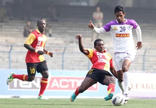 East Bengal's Orji penn tries to stop Prayag United's Asif Kottayil