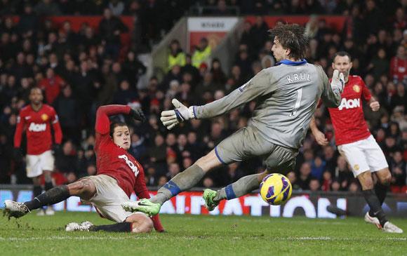 Manchester United's Javier Hernandez (L) scores past Newcastle United's Tim Krul at Old Trafford