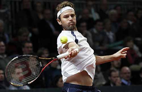 Mardy Fish of the U.S. hits a return to Wawrinka of Switzerland during their first Davis Cup tennis match in Fribourg