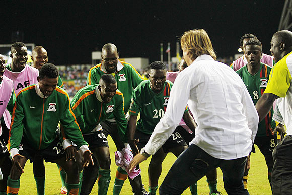 Zambia's head coach Herve Renard dance with his team after their victory against Ivory Coast in their African Nations Cup final soccer match at the Stade De L'Amitie Stadium in Libreville.